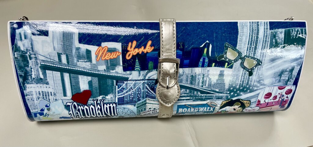 MAGAZINE CLUTCH WITH STRAP