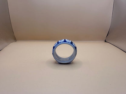 BLUE AND WHITE PORCELAIN NAPKIN RINGS SET OF 4
