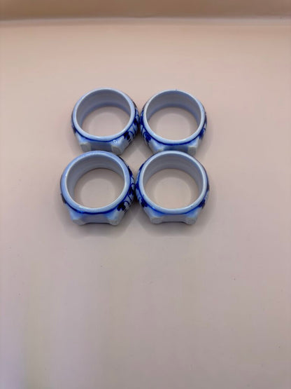 BLUE AND WHITE PORCELAIN NAPKIN RINGS SET OF 4