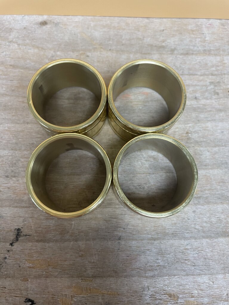 BALDWIN BRASS GOLD POLISHED NAPKIN RINGS SET OF 4